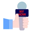 icona: mano che tiene un microfono, simboleggiando l'intervista alla fiera NY NOW
